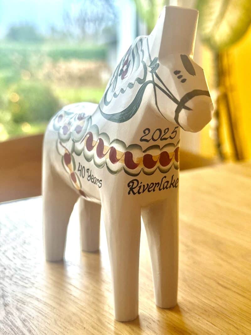 White Dala horse figurine commemorating Riverlake 40 years 2025